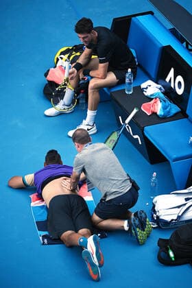 TENNIS AUSTRALIAN OPEN, Thanasi Kokkinakis of Australia (R) looks on as Nick Kyrgios receives treatment during their second Round Men s doubles match against Lukasz Kubot of Poland and Wesley Koolhof of the Netherlands on Day 7 of the Australian Open at Melbourne Park in Melbourne, Sunday, February 14, 2021. ( NO ARCHIVING, EDITORIAL USE ONLY, NO USE IN BOOKS WITHOUT CONSENT MELBOURNE VIC AUSTRALIA  Copyright: xDEANxLEWINSx 20210214001520492050