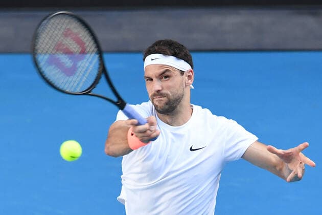 TENNIS AUSTRALIAN OPEN, Grigor Dimitrov of Bulgaria in action during his fourth Round Men s singles match against Dominic Thiem of Austria on Day 7 of the Australian Open at Melbourne Park in Melbourne, Sunday, February 14, 2021. ( NO ARCHIVING, EDITORIAL USE ONLY, NO USE IN BOOKS WITHOUT CONSENT MELBOURNE VIC AUSTRALIA  Copyright: xDAVExHUNTx 20210214001520496031