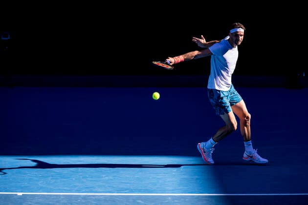 MELBOURNE, VIC - FEBRUARY 14: Grigor Dimitrov of Bulgaria returns the ball during round 4 of the 2021 Australian Open on February 14 2020, at Melbourne Park in Melbourne, Australia. (Photo by Jason Heidrich Icon Sportswire) TENNIS: FEB 14 Australian Open Icon2102141487
