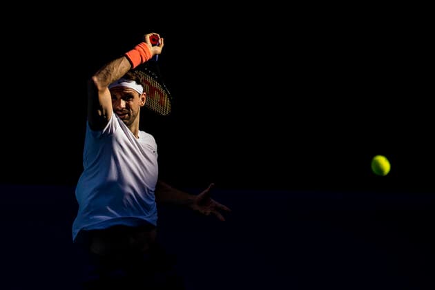MELBOURNE, VIC - FEBRUARY 14: Grigor Dimitrov of Bulgaria returns the ball during round 4 of the 2021 Australian Open on February 14 2020, at Melbourne Park in Melbourne, Australia. (Photo by Jason Heidrich Icon Sportswire) TENNIS: FEB 14 Australian Open Icon2102141517