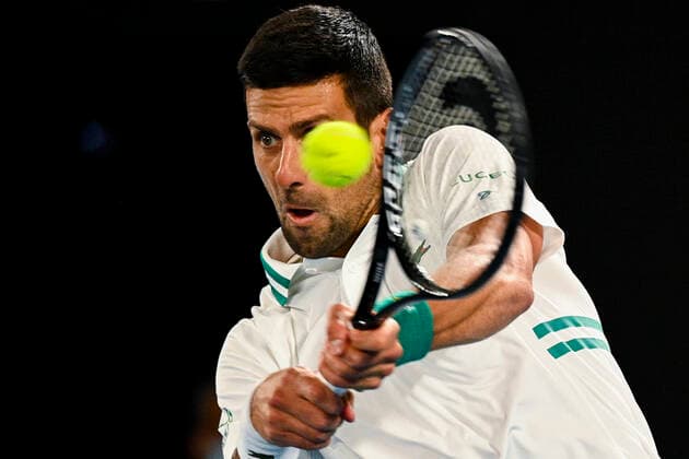 TENNIS AUSTRALIAN OPEN, Novak Djokovic of Serbia in action during his fourth Round Men s singles match against Milos Raonic of Canada on Day 7 of the Australian Open at Melbourne Park in Melbourne, Sunday, February 14, 2021. ( NO ARCHIVING, EDITORIAL USE ONLY, NO USE IN BOOKS WITHOUT CONSENT MELBOURNE VIC AUSTRALIA  Copyright: xDEANxLEWINSx 20210214001520519087