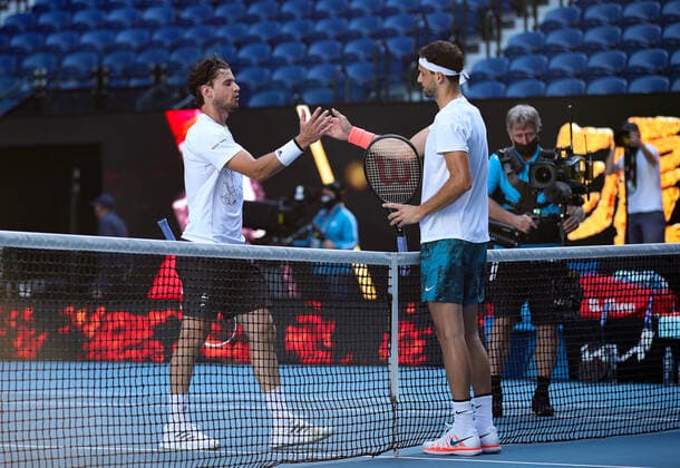 (210214) -- MELBOURNE, Feb. 14, 2021 -- Grigor Dimitrov (R) reacts with Dominic Thiem after the men s singles 4th round match between Dominic Thiem of Austria and Grigor Dimitrov of Bulgaria at the Australian Open 2021 tennis tournament in Melbourne Park, Melbourne, Australia, on Feb. 14, 2021 ) (SP)AUSTRALIA-MELBOURNE-TENNIS-AUSTRALIAN OPEN-DAY 7 BaixXuefei 
