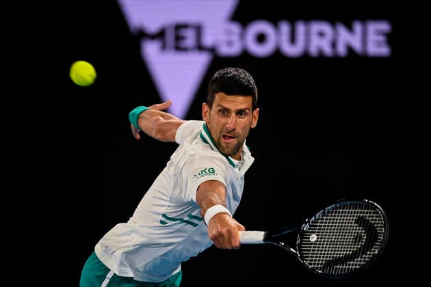 TENNIS AUSTRALIAN OPEN, Novak Djokovic of Serbia in action during his fourth Round Men s singles match against Milos Raonic of Canada on Day 7 of the Australian Open at Melbourne Park in Melbourne, Sunday, February 14, 2021. ( NO ARCHIVING, EDITORIAL USE ONLY, NO USE IN BOOKS WITHOUT CONSENT MELBOURNE VIC AUSTRALIA  Copyright: xDEANxLEWINSx 20210214001520525468
