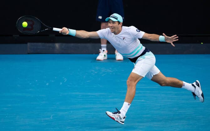 (210214) -- MELBOURNE, Feb. 14, 2021 -- Dusan Lajovic hits a return during the men s singles 4th round match between Alexander Zverev of Germany and Dusan Lajovic of Serbia at the Australian Open 2021 tennis tournament in Melbourne Park, Melbourne, Australia, on Feb. 14, 2021 (Photo by Xinhua) (SP)AUSTRALIA-MELBOURNE-TENNIS-AUSTRALIAN OPEN-DAY 7 HuxJingchen 