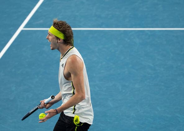 (210214) -- MELBOURNE, Feb. 14, 2021 -- Alexander Zverev reacts during the men s singles 4th round match between Alexander Zverev of Germany and Dusan Lajovic of Serbia at the Australian Open 2021 tennis tournament in Melbourne Park, Melbourne, Australia, on Feb. 14, 2021 (Photo by Xinhua) (SP)AUSTRALIA-MELBOURNE-TENNIS-AUSTRALIAN OPEN-DAY 7 HuxJingchen 