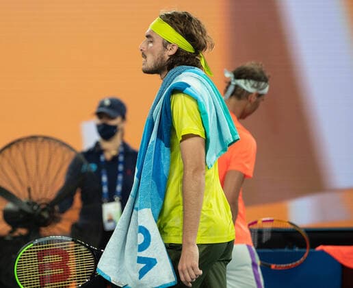 (210217) -- MELBOURNE, Feb. 17, 2021 -- Stefanos Tsitsipas reacts during the men s singles quarterfinal match between Rafael Nadal of Spain and Stefanos Tsitsipas of Greece at Australian Open in Melbourne Park, in Melbourne, Australia, on Feb. 17, 2021. (Photo by Xinhua) (SP)AUSTRALIA-MELBOURNE-TENNIS-AUSTRALIAN OPEN-DAY 10 HuxJingchen 