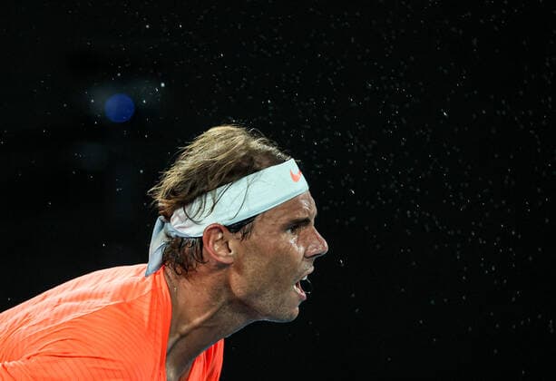 (210217) -- MELBOURNE, Feb. 17, 2021 -- Rafael Nadal reacts during the men s singles quarterfinal match between Rafael Nadal of Spain and Stefanos Tsitsipas of Greece at Australian Open in Melbourne Park, in Melbourne, Australia, on Feb. 17, 2021. ) (SP)AUSTRALIA-MELBOURNE-TENNIS-AUSTRALIAN OPEN-DAY 10 BaixXuefei 