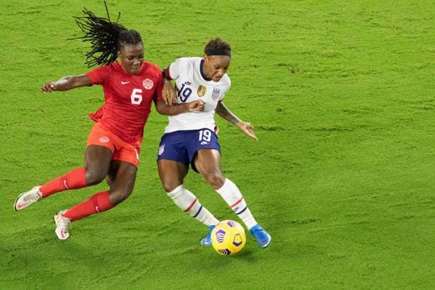 Orlando, Florida, Feb 18th 2021: Crystal Dunn ( 19 United States) battles for the ball during the She Believes Cup match between United States and Canada at Exploria Stadium in Orlando, Florida. Andrea Vilchez SPP She Believes Cup - United States v Canada 