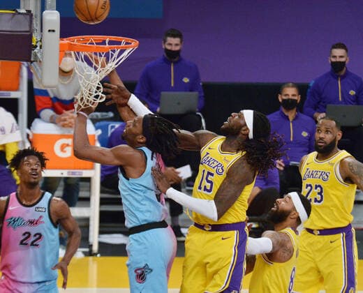Miami Heat guard Kendrick Nunn scores as he is fouled by Los Angeles Lakers center Montreal Harrell during the second half at Staples Center in Los Angeles on Saturday, February 20, 2021. The Heat defeated the Lakers 96-94.  LAP2021022007 JIMxRUYMEN