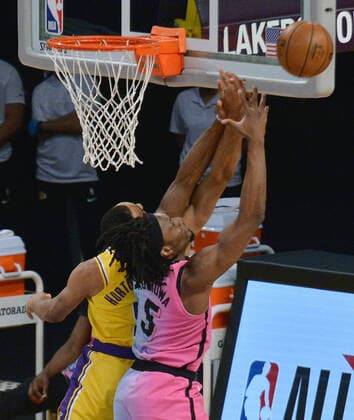 Los Angeles Lakers guard Talen Horton-Tucker and Miami Heat forward Precious Achiuwa fight for control of the offensive rebound uring the second half at Staples Center in Los Angeles on Saturday, February 20, 2021. The Heat defeated the Lakers 96-94.  LAP2021022003 JIMxRUYMEN