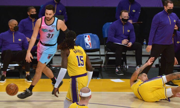 Los Angeles Lakers forward Kyle Kuzma falls to the floor after being fouled by Miami Heat guard Max Strus (31) during the second half at Staples Center in Los Angeles on Saturday, February 20, 2021. The Heat defeated the Lakers 96-94.  LAP2021022004 JIMxRUYMEN