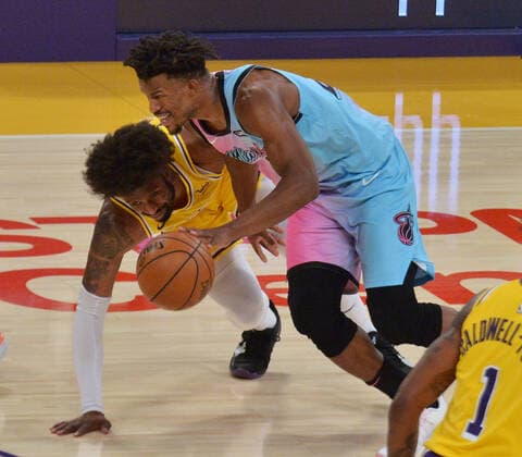 Miami Heat guard Jimmy Butler steals the ball from Los Angeles Lakers guard Wesley Matthews to score on the fast break during the second half at Staples Center in Los Angeles on Saturday, February 20, 2021. The Heat defeated the Lakers 96-94.  LAP2021022013 JIMxRUYMEN