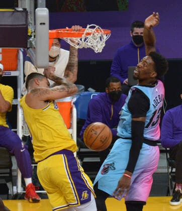 Los Angeles Lakers forward Kyle Kuzma jams for two points over Miami Heat center Bam Adebayo during the first half of the Lakers 96-94 loss at Staples Center in Los Angeles on Saturday, February 20, 2021.  LAP2021022021 JIMxRUYMEN