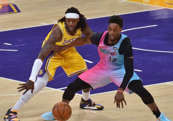 Los Angeles Lakers center Montrezl Harrell knocks the ball away from Miami Heat center Bam Adebayo during the first half of the Lakers 96-94 loss at Staples Center in Los Angeles on Saturday, February 20, 2021.  LAP2021022026 JIMxRUYMEN
