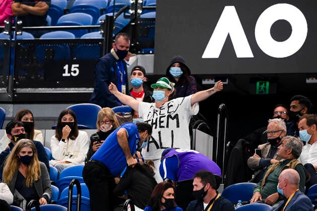 TENNIS AUSTRALIAN OPEN, Security guards remove protesters during the Men s singles finals match between Novak Djokovic of Serbia and Daniil Medvedev of Russia on Day 14 of the Australian Open at Melbourne Park in Melbourne, Sunday, February 21, 2021. ( NO ARCHIVING, EDITORIAL USE ONLY, NO USE IN BOOKS WITHOUT CONSENT MELBOURNE VIC AUSTRALIA  Copyright: xDAVExHUNTx 20210221001522075653