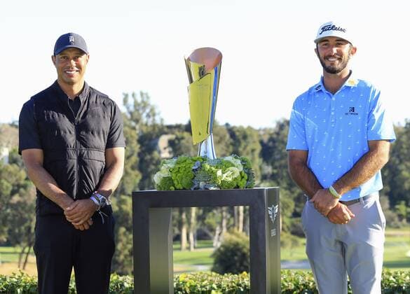 Golf: Genesis Invitational Max Homa (R) of the United States poses with his trophy after winning the Genesis Invitational golf tournament at Riviera Country Club in Pacific Palisades, California, on Feb. 21, 2021, next to tournament host Tiger Woods. 