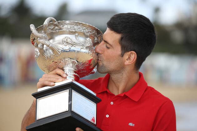 Novak Djokovic, SRB, presenting his trophy after 2021 Australian Open final in Melbourne on Brighton beach, 22 02 2021; -