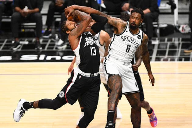 LOS ANGELES, CA - FEBRUARY 21: Los Angeles Clippers Guard Paul George (13) is fouled by Brooklyn Nets center DeAndre Jordan (6) during a NBA, Basketball Herren, USA game between the Brooklyn Nets and the Los Angeles Clippers on February 21, 2021 at STAPLES Center in Los Angeles, CA. The game was played without fans due to the COVID-19 pandemic. (Photo by Brian Rothmuller Icon Sportswire) NBA: FEB 21 Nets at Clippers Icon210221028