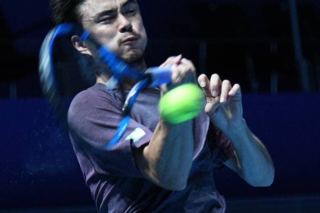 (210222) -- SINGAPORE, Feb. 22, 2021 -- Japan s Daniel Taro returns a ball during the men s singles first round match between Japan s Daniel Taro and India s Ramkumar Ramanathan at the Singapore Tennis Open in Singapore, Feb. 22, 2021. (Photo by Xinhua) (SP)SINGAPORE-TENNIS-SINGAPORE OPEN-MEN S SINGLES ThenxChihxWey 