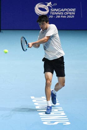 (210222) -- SINGAPORE, Feb. 22, 2021 -- Japan s Daniel Taro returns a ball during the men s singles first round match between Japan s Daniel Taro and India s Ramkumar Ramanathan at the Singapore Tennis Open in Singapore, Feb. 22, 2021. (Photo by Xinhua) (SP)SINGAPORE-TENNIS-SINGAPORE OPEN-MEN S SINGLES ThenxChihxWey 