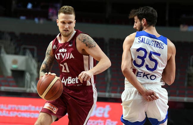 (210223) -- RIGA, Feb. 23, 2021 -- Aigars Skele (L) of Latvia vies with Christos Saloustros of Greece during the FIBA EuroBasket 2022 qualifying basketball match between Latvia and Greece in Riga, Latvia, Feb. 22, 2021. (Photo by Xinhua) (SP)LATVIA-RIGA-BASKETBALL-FIBA EUROBASKET 2022 QUALIFIERS-LATVIA VS GREECE EdijsxPalens 