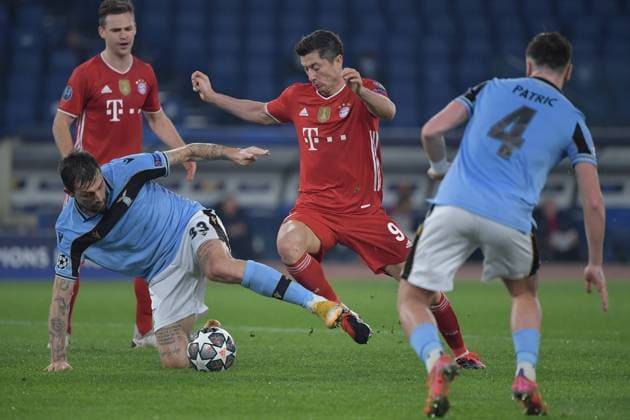 Robert Lewandowski of FC Bayer, Francesco Acerbi and Patric Gill of SS Lazio during the Champions League round of 16 football match between SS Lazio and Bayern Munchen at stadio Olimpico in Rome (Italy), February, 23th, 2021. Photo Andrea Staccioli Insidefoto andreaxstaccioli