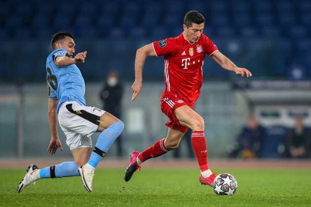 UEFA Champions League ( SS Lazio VS Bayern Muenchen - 2021 02 23 ) ROME, ITALY, FEB 23: Robert Lewandowski of Bayern München is tackled by Gonzalo Escalante of SS Lazio during the UEFA Champions League Round of 16 match between Lazio Roma and Bayern München at Olimpico Stadium on February 23, 2021 in Rome, Italy. Bayern München won the match 4-1 . Rome Olympic Stadium Italy 6197_232753 Copyright: xGiampieroxSposito PentaxPressx