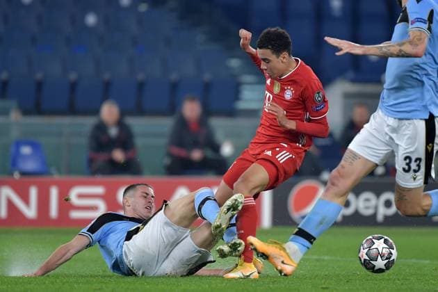Adam Marusic of SS Lazio and Jamal Musiala of FC Bayern Munchen compete for the ball during the Champions League round of 16 football match between SS Lazio and Bayern Munchen at stadio Olimpico in Rome (Italy), February, 23th, 2021. Photo Andrea Staccioli Insidefoto andreaxstaccioli