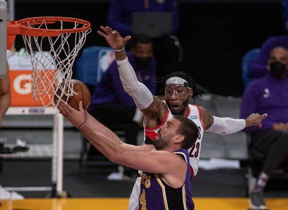 Marc Gasol 14 of the Los Angeles Lakers drives to the basket against Robert Covington 23 of the Portland Trailblazers during their regular season NBA, Basketball Herren, USA game with the Portland Trailblazers at the Staples Center in Los Angeles, California, USA, Friday February 26, 2021. Lakers vs Trailblazers !ACHTUNG: NUR REDAKTIONELLE NUTZUNG!  Copyright: xJAVIERxROJASx AME8495 20210227-637500049468629787