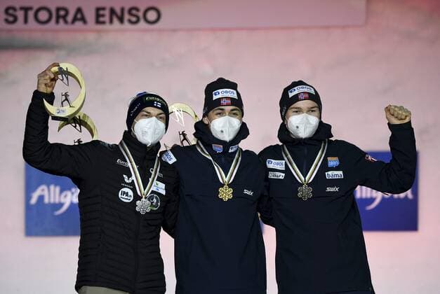 Ilkka Herola of Finland (L), winner Jarl Magnus Riiber (C) and third placed Jens Luraas Oftebro of Norway celebrate on the podium of the men s 10km individual Gundersen Nordic Combined medal ceremony event at the FIS Nordic Ski World Championships in Oberstdorf, Germany, on February 27, 2021. Oberstdorf Germany LKFTJK20210227204321CSJN  Copyright: xEmmixKorhonenx