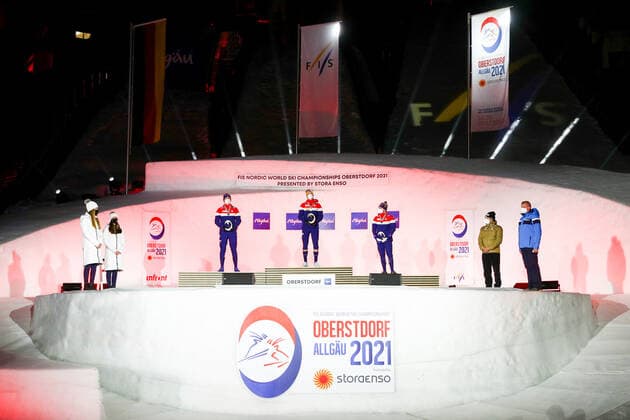 OBERSTDORF, GERMANY - FEBRUARY 27, 2021: Silver medalist Erik Valnes, gold medalist Johannes Hoesflot Klaebo, and bronze medalist Haavard Solaas Taugboel (L-R center) of Norway during an award ceremony for the men s classic sprint event at the 2021 FIS Nordic World Ski Championships. Sergei Bobylev TASS  TS0F8081