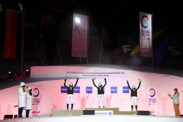 NORDIC SKIING - FIS Nordic World Ski Championships Oberstdorf 2021 OBERSTDORF,GERMANY,27.FEB.21 - NORDIC SKIING, NORDIC COMBINED - FIS Nordic World Ski Championships, ladies, award ceremony. Image shows the rejoicing of Mari Leinan Lund, Gyda Westvold Hansen and Marte Leinan Lund (NOR). GEPAxpictures xChristianxWalgram