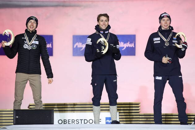 NORDIC SKIING - FIS Nordic World Ski Championships Oberstdorf 2021 OBERSTDORF,GERMANY,27.FEB.21 - NORDIC SKIING, NORDIC COMBINED - FIS Nordic World Ski Championships, men, award ceremony. Image shows the rejoicing of Ilkka Herola (FIN), Jarl Magnus Riiber and Jens Luraas Oftebro (NOR). GEPAxpictures xChristianxWalgram