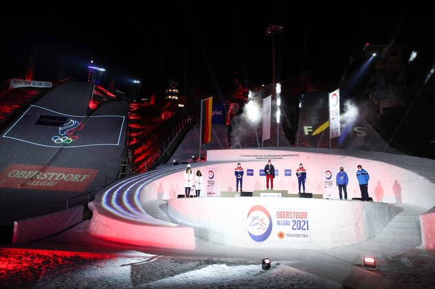 OBERSTDORF, GERMANY - FEBRUARY 28, 2021: Silver medalist Simen Hegstad Krueger of Norway, Gold medalist Alexander Bolshunov of Russia and Bronze medalist Hans Christer Holund (L-R) of Norway pose for a photograph during an award ceremony for the men s 30km skiathlon event at the 2021 FIS Nordic World Ski Championships. Sergei Bobylev TASS  TS0F8216