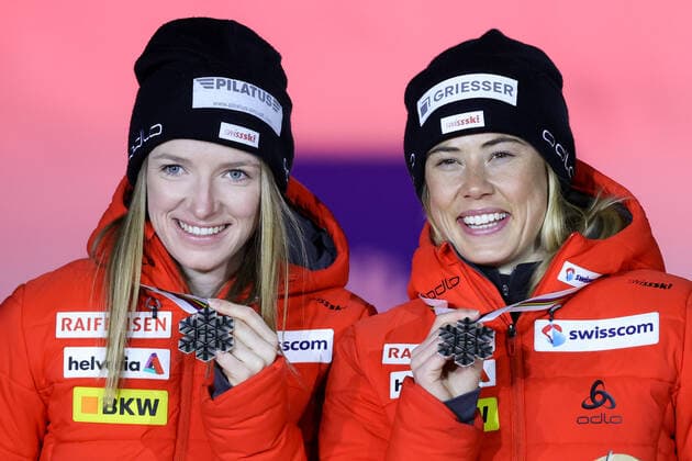 NORDIC SKIING - FIS Nordic World Ski Championships Oberstdorf 2021 OBERSTDORF,GERMANY,28.FEB.21 - NORDIC SKIING, CROSS COUNTRY SKIING - FIS Nordic World Ski Championships, sprint, team event, ladies, award ceremony. Image shows Laurien Van Der Graaff and Nadine Faehndrich (SUI). Keywords: medal. GEPAxpictures xChristianxWalgram
