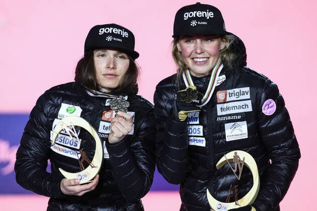 OBERSTDORF, GERMANY - FEBRUARY 28, 2021: Bronze medalists Eva Urevc (L) and Anamarija Lampic of Slovenia pose for a photograph during an award ceremony for the women s team sprint event at the 2021 FIS Nordic World Ski Championships. Sergei Bobylev TASS  TS0F822D