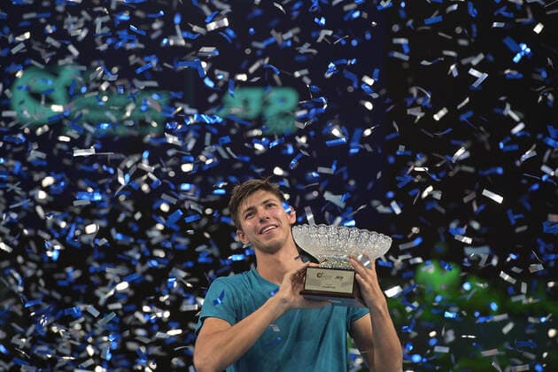 (210301) -- BEIJING, March 1, 2021 -- Alexei Popyrin of Australia celebrates during the awarding ceremony after the men s singles final against Alexander Bublik of Kazakhstan at the Singapore Tennis Open tournament in Singapore on Feb. 28, 2021. (Photo by Xinhua) XINHUA PHOTOS OF THE DAY ThenxChihxWey 