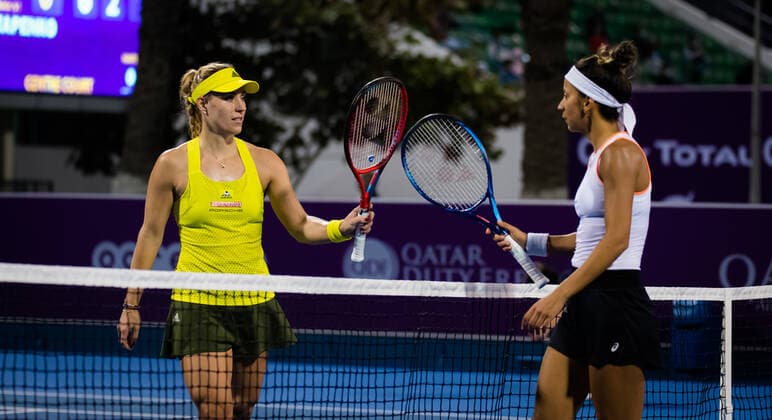 March 1, 2021, DOHA, QATAR: Angelique Kerber of Germany & Cagla Buyukakcay of Turkey in action during her first round match at the 2021 Qatar Total Open WTA, Tennis Damen 500 tournament DOHA QATAR - ZUMAa181 20210301_zaa_a181_195 Copyright: xRobxPrangex