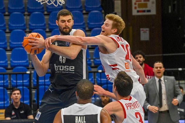 L-R David Kravish of Bamberg and Hayden Dalton of Nymburk in action during the Men s Basketball Champions League 1st round group L match ERA Nymburk vs Brose Bamberg in Nymburk, Czech Republic, March 2nd, 2021. (CTKxPhoto VitxSimanek) CTKPhotoP202103021039401  VIS 004