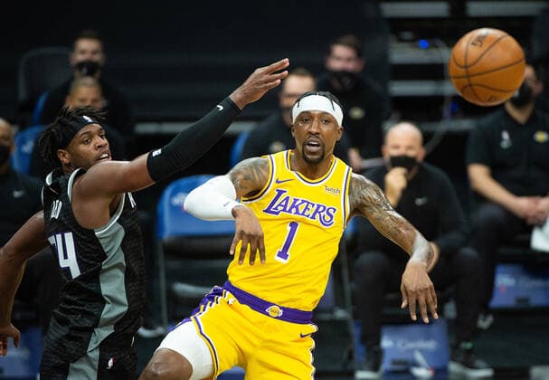 March 3, 2021, Sacramento, CA, USA: Los Angeles Lakers guard Kentavious Caldwell-Pope (1) pass around Sacramento Kings guard Buddy Hield (24) in the first quarter during a game at Golden 1 Center on Wednesday, Mar. 3, 2021 in Sacramento. Sacramento USA - ZUMAj89_ 20210303_zaf_j89_003 Copyright: xPaulxKitagakixJr.x
