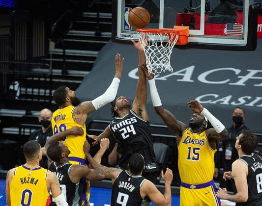 March 3, 2021, Sacramento, CA, USA: Sacramento Kings guard Buddy Hield (24) battles Los Angeles Lakers center Montrezl Harrell (15) and Los Angeles Lakers forward Markieff Morris (88) for rebound with seconds left in the fourth quarter during a game at Golden 1 Center on Wednesday, Mar. 3, 2021 in Sacramento. The Kings win 123-121. Sacramento USA - ZUMAj89_ 20210303_zaf_j89_024 Copyright: xPaulxKitagakixJr.x