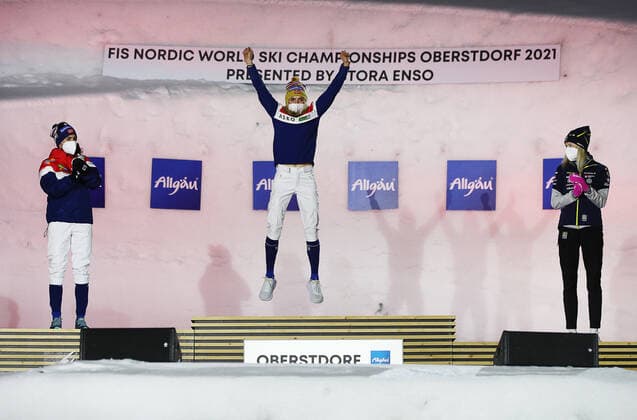 BAVARIA, GERMANY â€“ MARCH 6, 2021: Silver medallist Heidi Weng of Norway, gold medal winner Therese Johaug and bronze medallist Frida Karlsson of Sweden (L-R) celebrate during the medal ceremony for the womenâ€™s 30 km mass start classical cross-country competition at the 2021 FIS Nordic World Ski Championships in Oberstdorf, a resort in the Allgau Alps of Bavaria, Germany. Sergei Bobylev TASS  TS0F8BB8