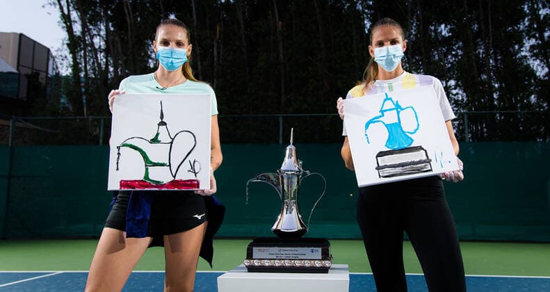 March 9, 2021, DUBAI, UNITED ARAB EMIRATES: Karolina Pliskova & Kristyna Pliskova of the Czech Republic paint the Dubai Duty Free Tennis Championships trophy at the 2021 Dubai Duty Free Tennis Championships WTA, Tennis Damen 1000 tournament DUBAI UNITED ARAB EMIRATES - ZUMAa181 20210309_zaa_a181_106 Copyright: xRobxPrangex