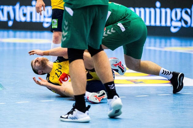 210309 Albin Lagergren of Sweden is in pain during the EHF EURO Qualification, EM, Europameisterschaft match between Sweden and Montenegro on March 9, 2021 in Lund. Copyright: MATHILDAxAHLBERG BB210309BB300