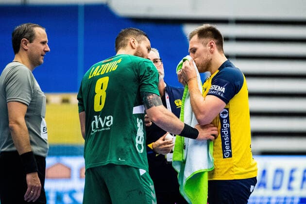 210309 Albin Lagergren of Sweden is in pain during the EHF EURO Qualification, EM, Europameisterschaft match between Sweden and Montenegro on March 9, 2021 in Lund. Copyright: MATHILDAxAHLBERG BB210309BB301