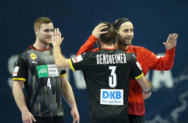 13.03.2021, Handball TOKYO Qualifikation 2020, Deutschland - Slowenien, in der Max-Schmeling-Halle Berlin. (L-R) Johannes Golla (Deutschland), Uwe Gensheimer (Deutschland) und Torwart Silvio Heinevetter (Deutschland) jubeln