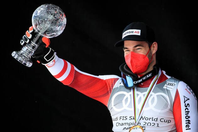 ALPINE SKIING - FIS WC Final Lenzerheide LENZERHEIDE,SWITZERLAND,18.MAR.21- ALPINE SKIING - FIS World Cup Final, award ceremony for the Super G World Cup, men. Image shows the rejoicing of Vincent Kriechmayr (AUT). Keywords: crystal globe, medal. GEPAxpictures xMarioxBuehner