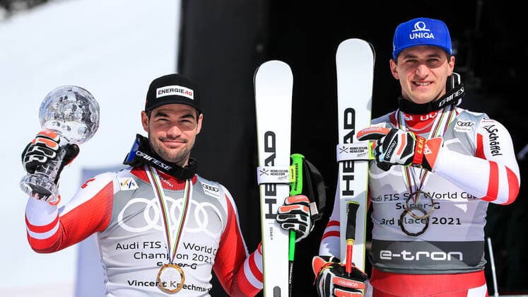 ALPINE SKIING - FIS WC Final Lenzerheide LENZERHEIDE,SWITZERLAND,18.MAR.21- ALPINE SKIING - FIS World Cup Final, award ceremony for the Super G World Cup, men. Image shows the rejoicing of Vincent Kriechmayr and Matthias Mayer (AUT). Keywords: crystal globe, medal. GEPAxpictures xMarioxBuehner
