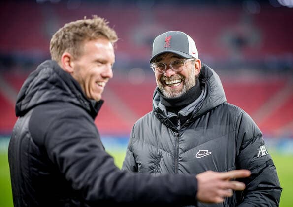 Liverpools Coach Juergen Klopp und Leipzigs Trainer Julian Nagelsmann stehen zusammen und unterhalten sich UEFA Champions League Achtelfinale, Rueckspiel FC Liverpool - RB Leipzig 2:0 10.03.2021, Puskas Arena in Budapest (Ungarn). FC Liverpool - RB Leipzig *** Liverpool coach Juergen Klopp and Leipzig coach Julian Nagelsmann stand together and talk UEFA Champions League Round of 16, second leg FC Liverpool RB Leipzig 2 0 10 03 2021, Puskas Arena in Budapest Hungary FC Liverpool RB Leipzig