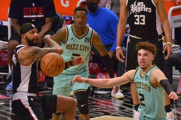 Charlotte Hornets guard LaMelo Ball loses the ball under pressure from Los Angeles Clippers forward Marcus Morris Sr. during the first half at Staples Center in Los Angeles on Saturday, March 20, 2021. The Clippers defeated the Hornets 125-98.  LAP2021032026 JIMxRUYMEN